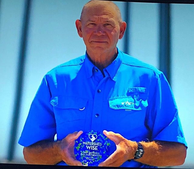 Allan Berger holding the Watershed Wise Award