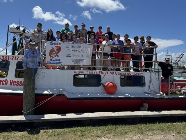 A group of students and parents aboard the RV Archimedes boat, the Texas Floating Classroom with Captain Whitney Curry.